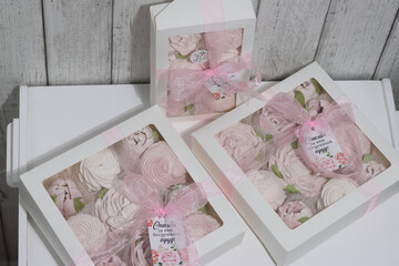 Three boxes of homemade marshmallows. Tied with a ribbon. The tags have the inscription in Russian...
