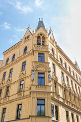 Old building decorated with statues and bas reliefs on the Vodickova Street in old part of the Prague in the Czech Republic