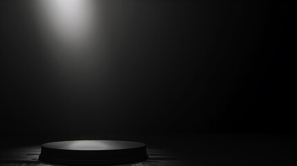 A black stage with a spotlight shining on it
