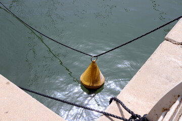a berth for mooring yachts and boats in a seaport.
