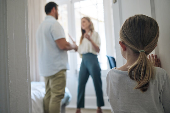 Child, door and parents in home with argument for infidelity, cheating or affair problem. Disagreement, conflict and back of girl kid watching mother and father fight in bedroom for toxic marriage.