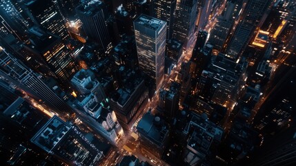 A city at night with many tall buildings and a lot of lights. The city is lit up and it looks very busy