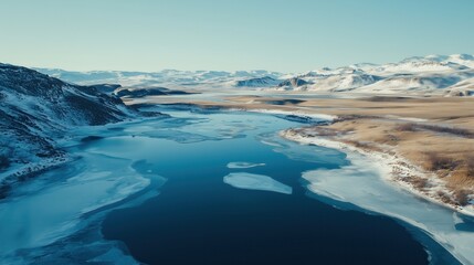 Fototapeta premium A frozen river with a blue sky in the background