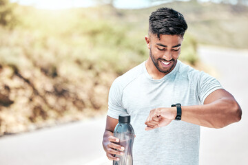 Outdoor, man and fitness on checking digital watch with smile to monitor or tracking health, wellness and wellbeing. Male person, water bottle and happy with running results, heart rate or progress