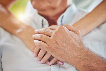 Hug, holding hands and chest of senior people for support, trust and comfort for care in nursing home. Retirement, healthcare and closeup of nurse with elderly person for kindness, help and wellness