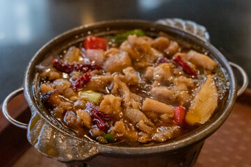 Chicken hot pot, with vegetables in soup. served in the restaurant