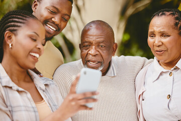 Obraz premium Man, woman and senior parents with phone checking modern technology, social media or news. Smartphone, photography and black family with mobile app for digital memory, online search or home bonding