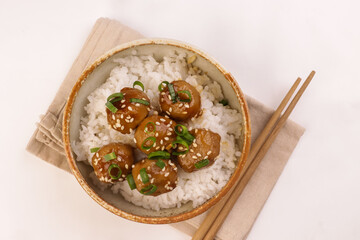 Meatballs Teriyaki with Sesame Seeds in a Bowl, Served with Rice.
