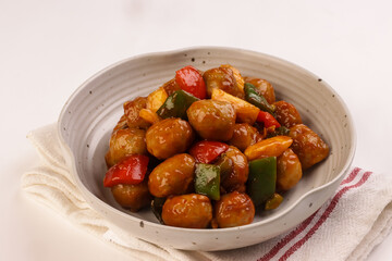 Sweet and Sour Meatballs with Pineapple and Vegetables.