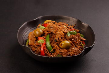 Ropa Vieja is Cuban Style Shredded Beef, Braised Beef in Cuban Style Sauce.