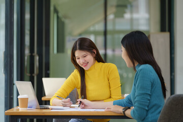 University students, study on campus laptops, research and education tests, exam books, and course projects. Young college students are learning online, technology, and knowledge in the cafe.