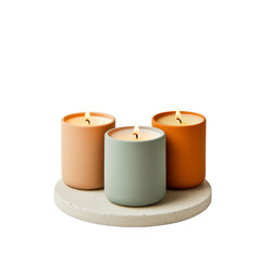 Three decorative candles in soft pastel colors, arranged on a light stone tray, creating a cozy and calming atmosphere.
