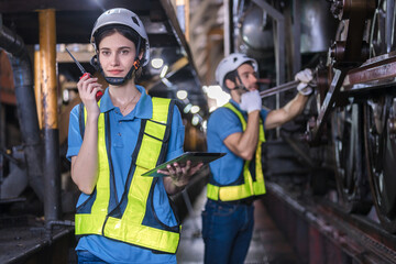Engineer checking construction process railway and checking work on railroad station . Railway...