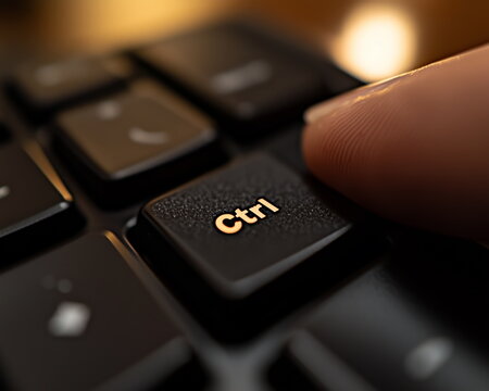 a finger on "Ctrl" key on keyboard