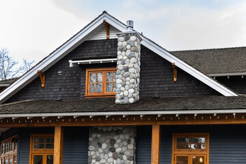 Country house in North America. Wooden house in green forest. wooden country house or cottage with wooden fence.