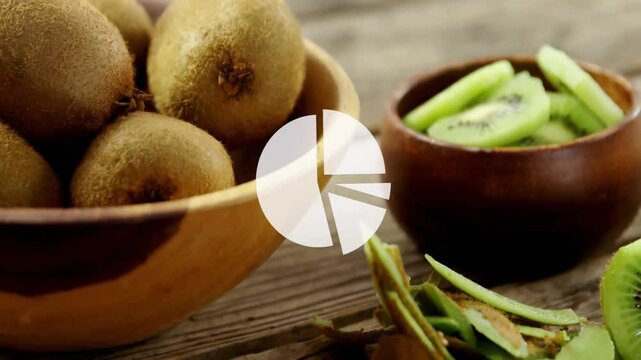Pie chart animation over fresh kiwi fruits in wooden bowls on rustic table