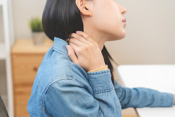 Body muscles hurt stiff, face suffering asian young woman, girl neck pain, body ache while sitting work at home, holding massaging rubbing back, problem health care of office syndrome people concept.