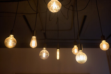 Artistic, vintage style light bulbs hanging elegantly in a modern and stylish living space