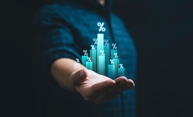 Businessman holding bar graph with percentage for business investment debt and dividend growth concept.