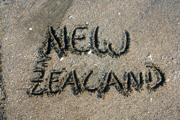 Fototapeta premium New Zealand inscription on the beach