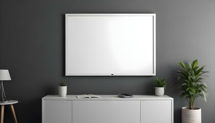 A large white framed canvas or projection screen mounted on a gray wall above a modern gray cabinet or entertainment.