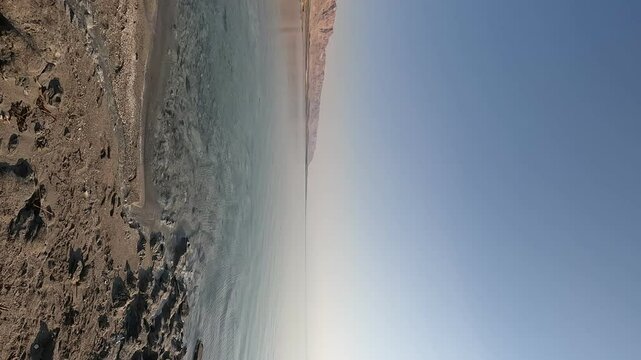 the Dead Sea's northern shores at Matzuki Darga in the soft light of early morning. This serene and wild beach showcases the unique landscape of Israel's Dead Sea