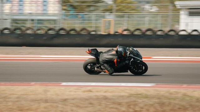 Motorcyclist rides on a race track. Motorcycle racer training.