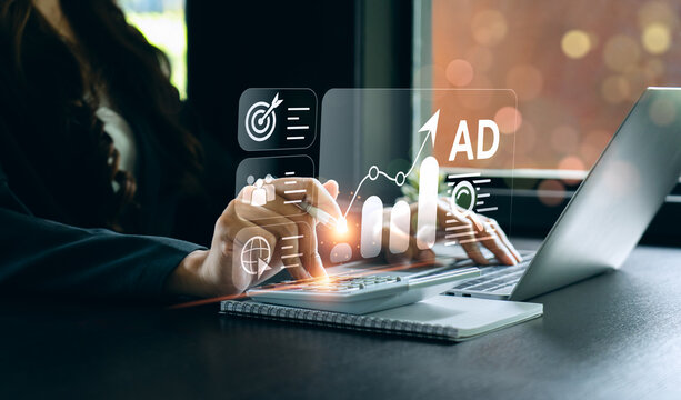 Businesswoman Using Laptop with Holographic Marketing Analytics Interface, Demonstrating Digital Advertising Strategy, Data Analysis, and Business Growth, Digital information marketing
