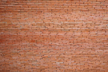Fototapeta premium A high-resolution image of a rustic red brick wall. 