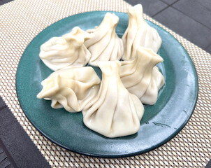 Khinkali in a plate on the table
