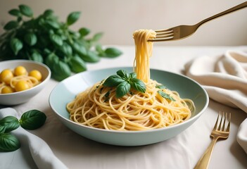 Fork Lifting a Strand of plain Spaghetti with Basil and Olive Oil