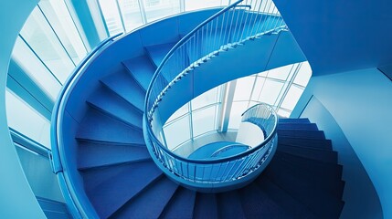 Fototapeta premium A blue spiral staircase inside a contemporary building, showcasing architectural elegance