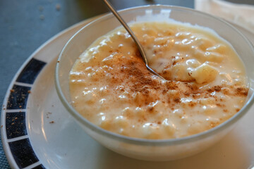Delicious rice pudding with cinnamon on bowl Spain