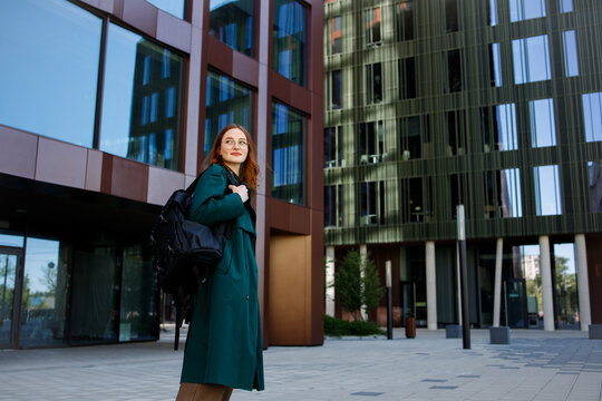 Ginger girl it worker or student with a backpack