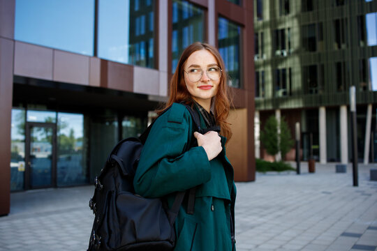 Ginger girl student  or it worker with a backpack portrait