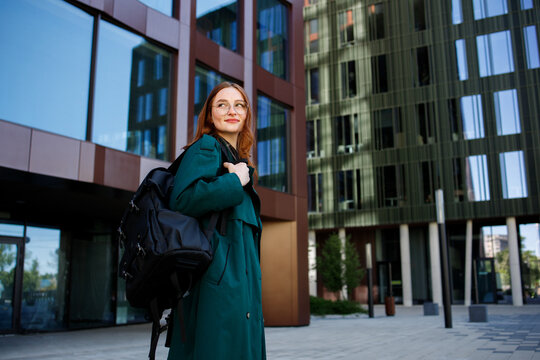 Ginger girl it worker or student with a backpack