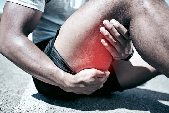 Hamstring pain, hands and person with injury on road after training accident and exercise risk closeup. Legs, fitness and runner with muscle inflammation, massage and problem with red glow outdoor