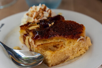 Portion of pudding caramel on plate for dessert Spain