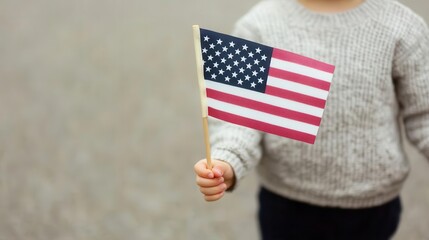 A child holding a small American flag at a memorial ceremony, Patriot Day, child, American flag