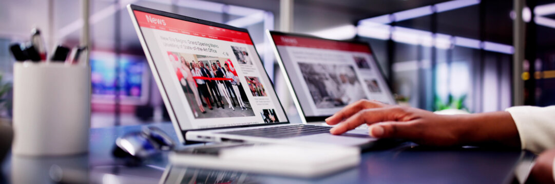 American Woman Views Online News Articles on Laptop and Phone While Relaxing