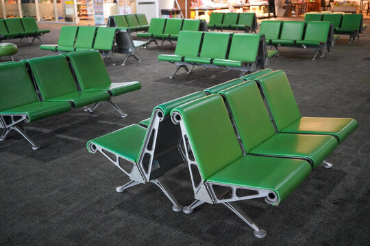 Rows of green seats for passengers look empty at the Ahmad Yani International Airport. Semarang, Indonesia.