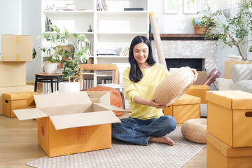 Young women moving home while packing boxes together and happy in new home.  Asia women investment real estate for living with family.  Investment and Family Concept