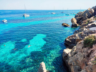 The awesome Red cove in Favignana island, Aegadian islands, Sicily, Italy. The stone present on the island is calcarenite, the reason of many old quarries. 