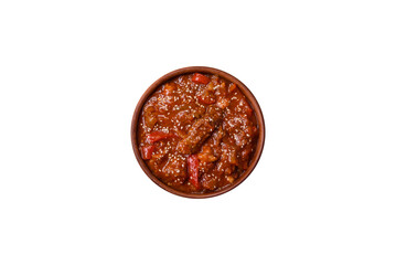 Thai Asian dish with meat, hot pepper, tomato sauce and sesame