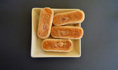 Delicious almond finger biscuits on the table.