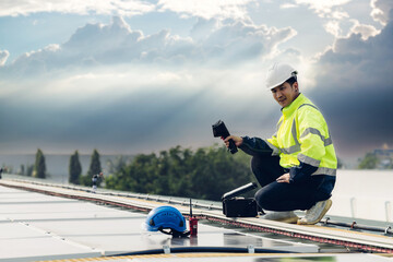 Inspector examination of photovoltaic modules using a thermal imaging camera. Engineer Checking...