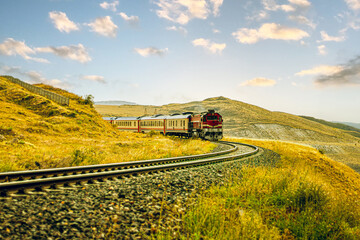Dogu Ekspresi or Scenic view of the Ankara-Kars Eastern Express train journey through Turkey's landscapes. © Husamex