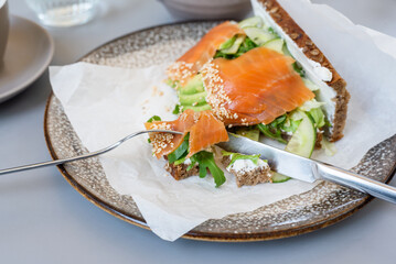 Toast with salmon and vegetables for breakfast.