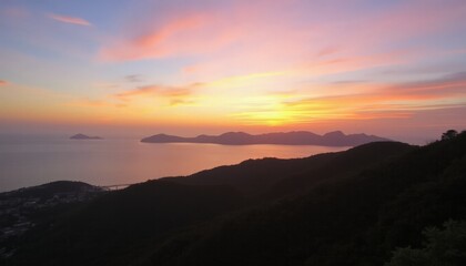 Obraz premium Scenic Coastal Sunset with Silhouetted Hills and Islands - Perfect for Nature and Landscape Photography