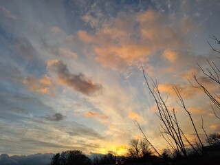 Serene Sunset Sky with Cirrus Clouds: A Perfect Background or Wallpaper
